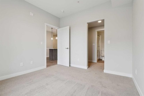 103-655 Shawnee Square Sw, Calgary, AB - Indoor Photo Showing Other Room