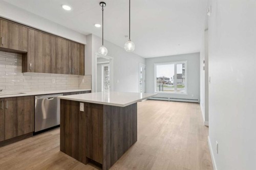 103-655 Shawnee Square Sw, Calgary, AB - Indoor Photo Showing Kitchen With Upgraded Kitchen