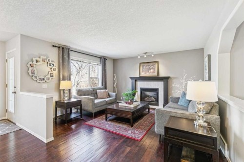 18519 Chaparral Manor Se, Calgary, AB - Indoor Photo Showing Living Room With Fireplace
