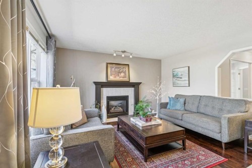 18519 Chaparral Manor Se, Calgary, AB - Indoor Photo Showing Living Room With Fireplace