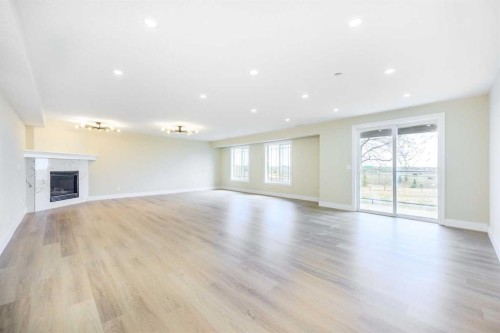 42 Royal Crest Point Nw, Calgary, AB - Indoor Photo Showing Living Room With Fireplace
