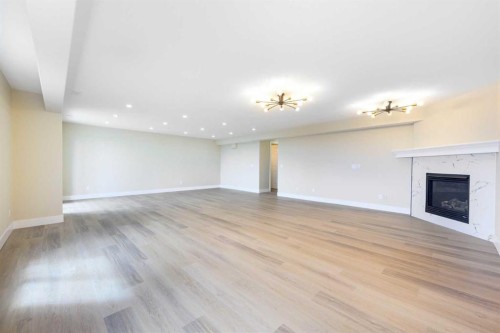 42 Royal Crest Point Nw, Calgary, AB - Indoor With Fireplace