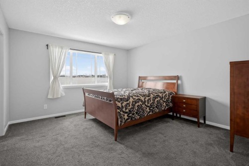 154 Yorkstone Way Sw, Calgary, AB - Indoor Photo Showing Bedroom