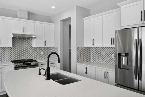 154 Yorkstone Way Sw, Calgary, AB - Indoor Photo Showing Kitchen With Stainless Steel Kitchen With Double Sink With Upgraded Kitchen