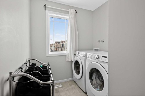 154 Yorkstone Way Sw, Calgary, AB - Indoor Photo Showing Laundry Room