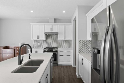 154 Yorkstone Way Sw, Calgary, AB - Indoor Photo Showing Kitchen With Stainless Steel Kitchen With Double Sink With Upgraded Kitchen