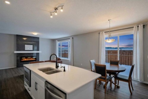 154 Yorkstone Way Sw, Calgary, AB - Indoor Photo Showing Kitchen With Double Sink