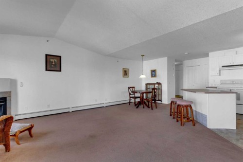 308-2000 Valleyview Park Se, Calgary, AB - Indoor Photo Showing Other Room With Fireplace