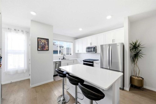 17 Precedence Glen, Cochrane, AB - Indoor Photo Showing Kitchen With Stainless Steel Kitchen
