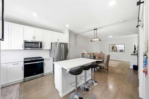 17 Precedence Glen, Cochrane, AB - Indoor Photo Showing Kitchen With Stainless Steel Kitchen