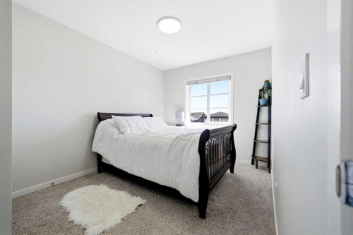 17 Precedence Glen, Cochrane, AB - Indoor Photo Showing Bedroom