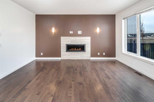 238 Silverado Plains Circle Sw, Calgary, AB - Indoor Photo Showing Living Room With Fireplace