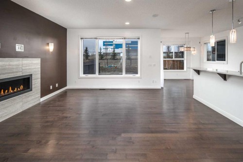 238 Silverado Plains Circle Sw, Calgary, AB - Indoor Photo Showing Living Room With Fireplace