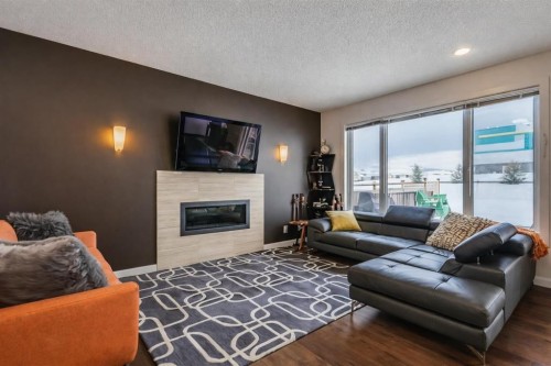 238 Silverado Plains Circle Sw, Calgary, AB - Indoor Photo Showing Living Room With Fireplace