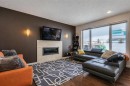 238 Silverado Plains Circle Sw, Calgary, AB  - Indoor Photo Showing Living Room With Fireplace 