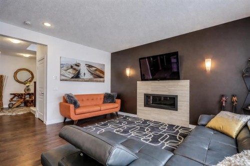 238 Silverado Plains Circle Sw, Calgary, AB - Indoor Photo Showing Living Room With Fireplace