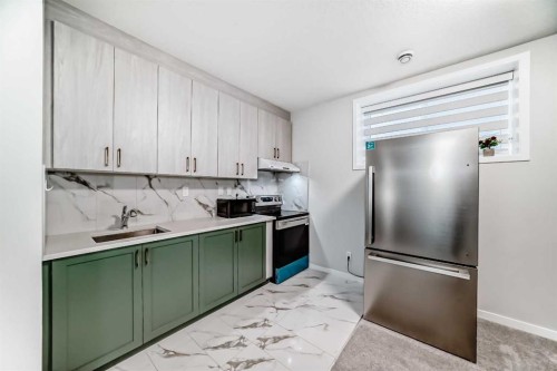 16 West Grove Link Sw, Calgary, AB - Indoor Photo Showing Kitchen