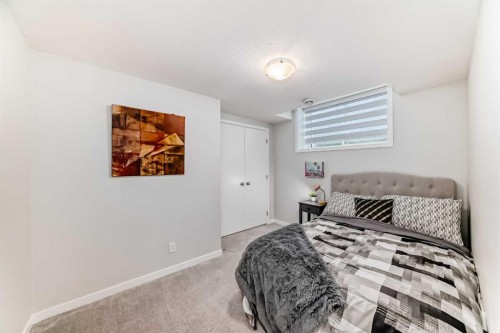 16 West Grove Link Sw, Calgary, AB - Indoor Photo Showing Bedroom