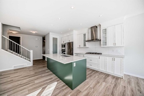 16 West Grove Link Sw, Calgary, AB - Indoor Photo Showing Kitchen With Upgraded Kitchen