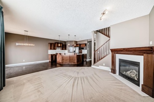 259 St Moritz Drive Sw, Calgary, AB - Indoor Photo Showing Living Room With Fireplace