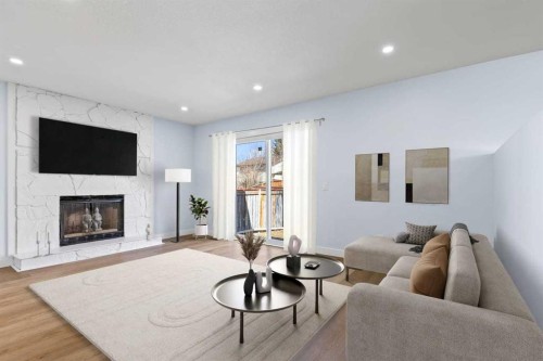 55 Whitehaven Crescent Ne, Calgary, AB - Indoor Photo Showing Living Room With Fireplace