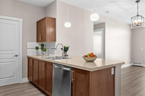 407-2300 Evanston Square Nw, Calgary, AB - Indoor Photo Showing Kitchen With Double Sink