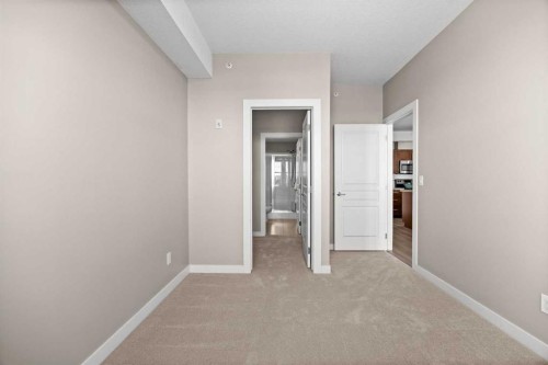 407-2300 Evanston Square Nw, Calgary, AB - Indoor Photo Showing Other Room