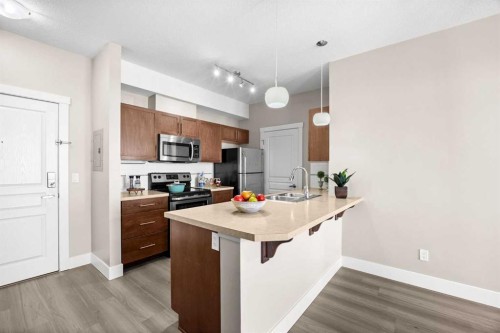 407-2300 Evanston Square Nw, Calgary, AB - Indoor Photo Showing Kitchen With Double Sink