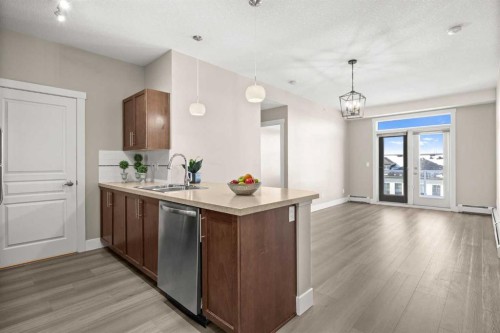 407-2300 Evanston Square Nw, Calgary, AB - Indoor Photo Showing Kitchen With Double Sink
