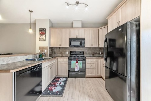 111 Ranch Ridge Meadow, Strathmore, AB - Indoor Photo Showing Kitchen With Double Sink