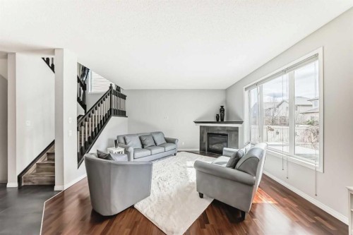 65 Morningside Circle Sw, Airdrie, AB - Indoor Photo Showing Living Room With Fireplace