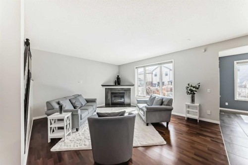 65 Morningside Circle Sw, Airdrie, AB - Indoor Photo Showing Living Room With Fireplace
