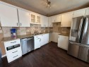 93-1555 Falconridge Drive, Calgary, AB  - Indoor Photo Showing Kitchen With Double Sink With Upgraded Kitchen 