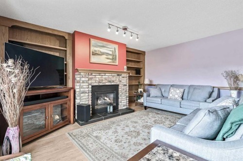 124 Catalina Place Ne, Calgary, AB - Indoor Photo Showing Living Room With Fireplace