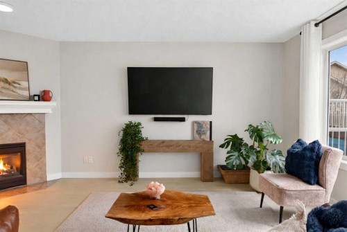 10 Somerglen Crescent Sw, Calgary, AB - Indoor Photo Showing Living Room With Fireplace