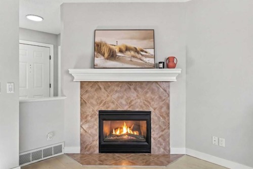 10 Somerglen Crescent Sw, Calgary, AB - Indoor Photo Showing Living Room With Fireplace