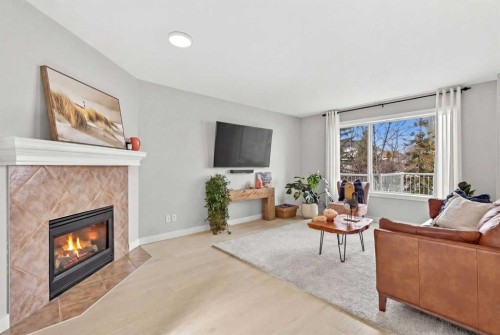 10 Somerglen Crescent Sw, Calgary, AB - Indoor Photo Showing Living Room With Fireplace