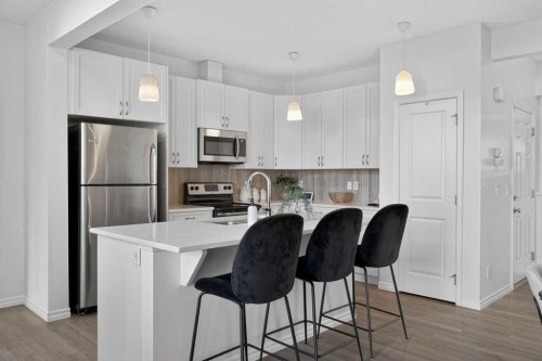 190 River Heights Crescent, Cochrane, AB - Indoor Photo Showing Kitchen With Stainless Steel Kitchen