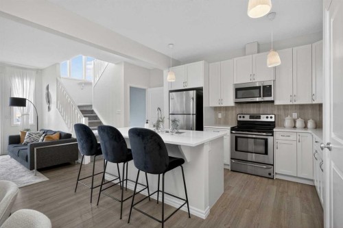 190 River Heights Crescent, Cochrane, AB - Indoor Photo Showing Kitchen With Stainless Steel Kitchen With Upgraded Kitchen