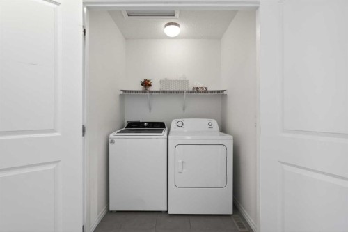 190 River Heights Crescent, Cochrane, AB - Indoor Photo Showing Laundry Room