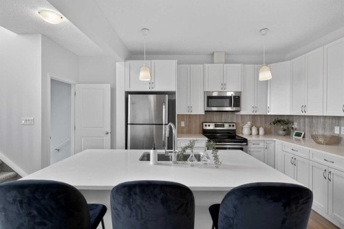 190 River Heights Crescent, Cochrane, AB - Indoor Photo Showing Kitchen With Stainless Steel Kitchen With Upgraded Kitchen