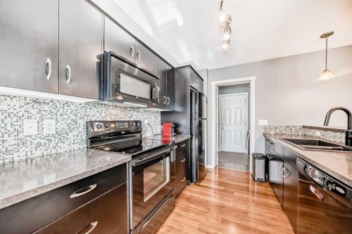 136 Sage Valley Drive Nw, Calgary, AB - Indoor Photo Showing Kitchen With Double Sink With Upgraded Kitchen