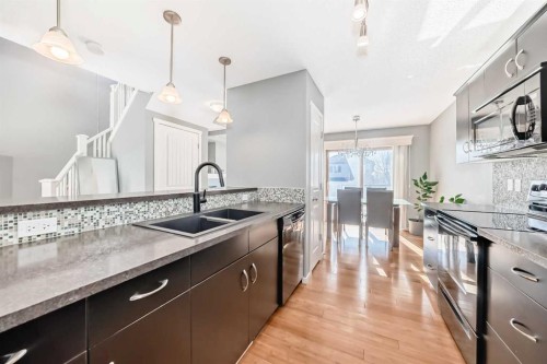 136 Sage Valley Drive Nw, Calgary, AB - Indoor Photo Showing Kitchen With Double Sink With Upgraded Kitchen