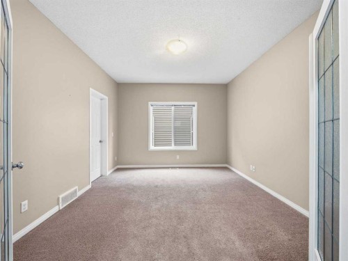 32 Panatella Parade Nw, Calgary, AB - Indoor Photo Showing Other Room