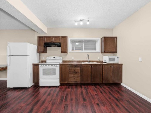 32 Panatella Parade Nw, Calgary, AB - Indoor Photo Showing Kitchen With Double Sink