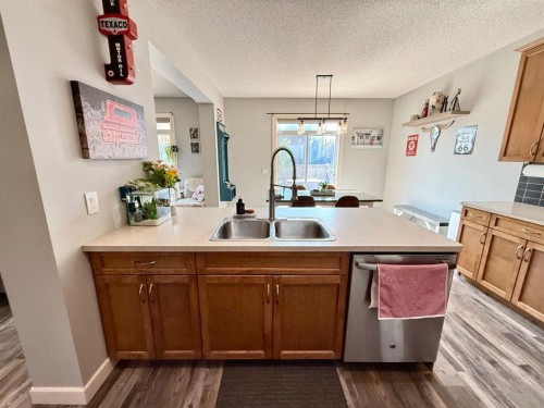 607 Montgomery Close Se, High River, AB - Indoor Photo Showing Kitchen With Double Sink