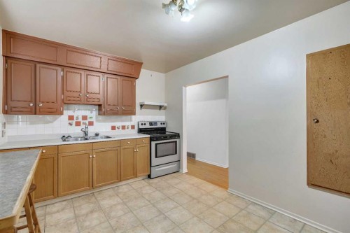 604 56 Avenue Sw, Calgary, AB - Indoor Photo Showing Kitchen With Double Sink