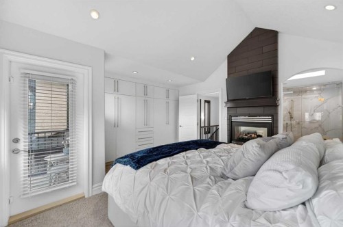 1924 48 Avenue Sw, Calgary, AB - Indoor Photo Showing Bedroom With Fireplace