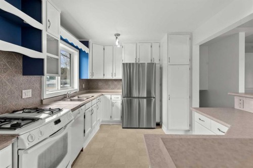 67 Hooke Road Sw, Calgary, AB - Indoor Photo Showing Kitchen With Stainless Steel Kitchen With Double Sink
