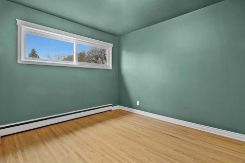 67 Hooke Road Sw, Calgary, AB - Indoor Photo Showing Other Room